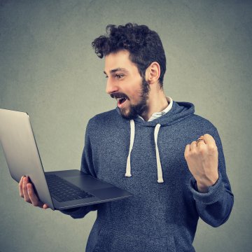 Man with laptop in his arms